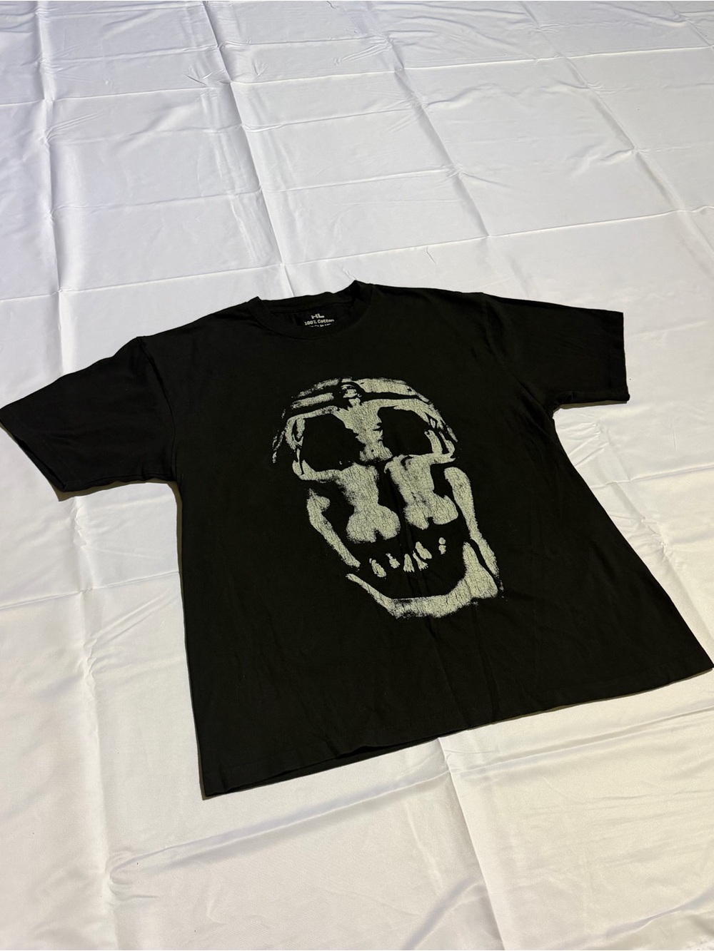 Vintage Black Short-Sleeve Tee with Pale Skull Graphic